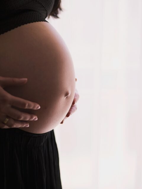 woman holding stomach