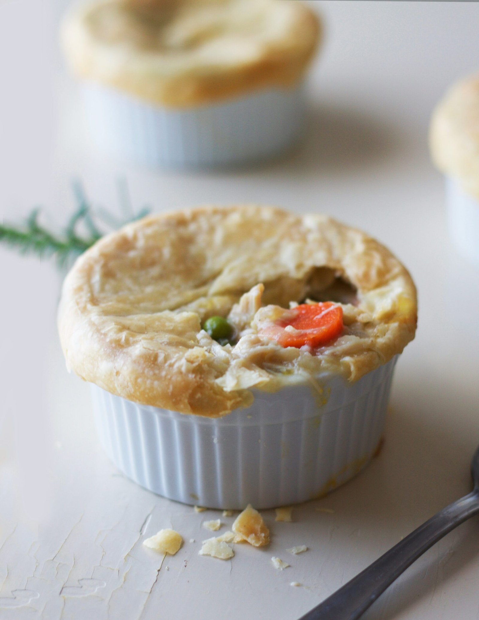 white ceramic bowl with white cream. Homemade Turkey Pot Pie